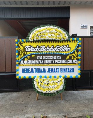 Papan Bunga Duka di Puser